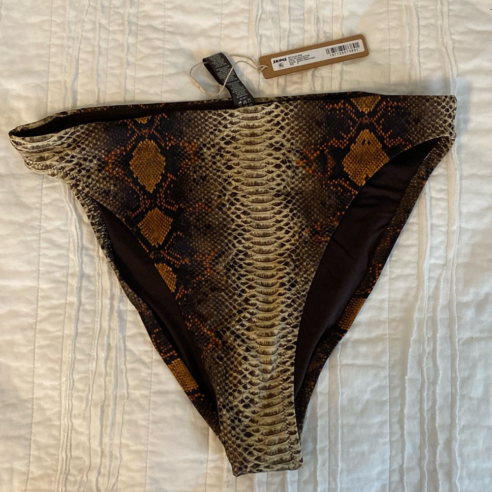 Skims high leg bikini bottom, snake print, size medium. New with tags.